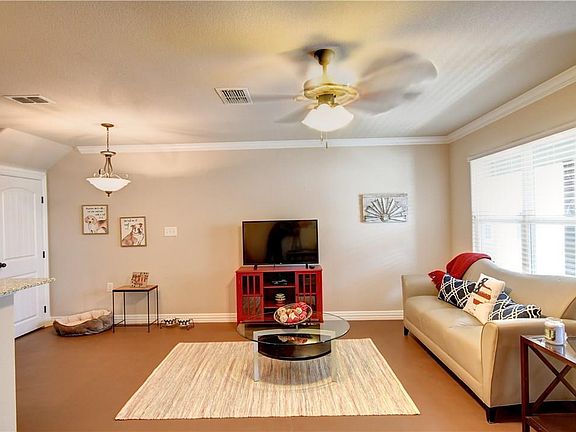 Living Room has a dining area, large closet under the stairs for pantry or extra storage space, break fast bar area