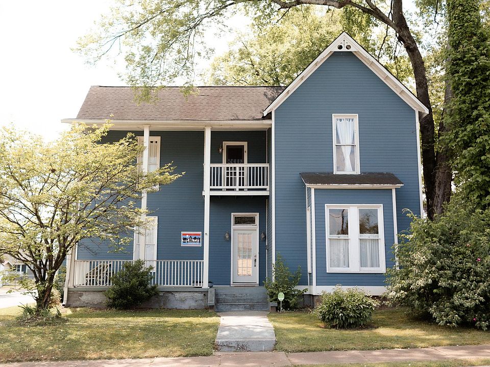 Front of home; new landscaping not depicted