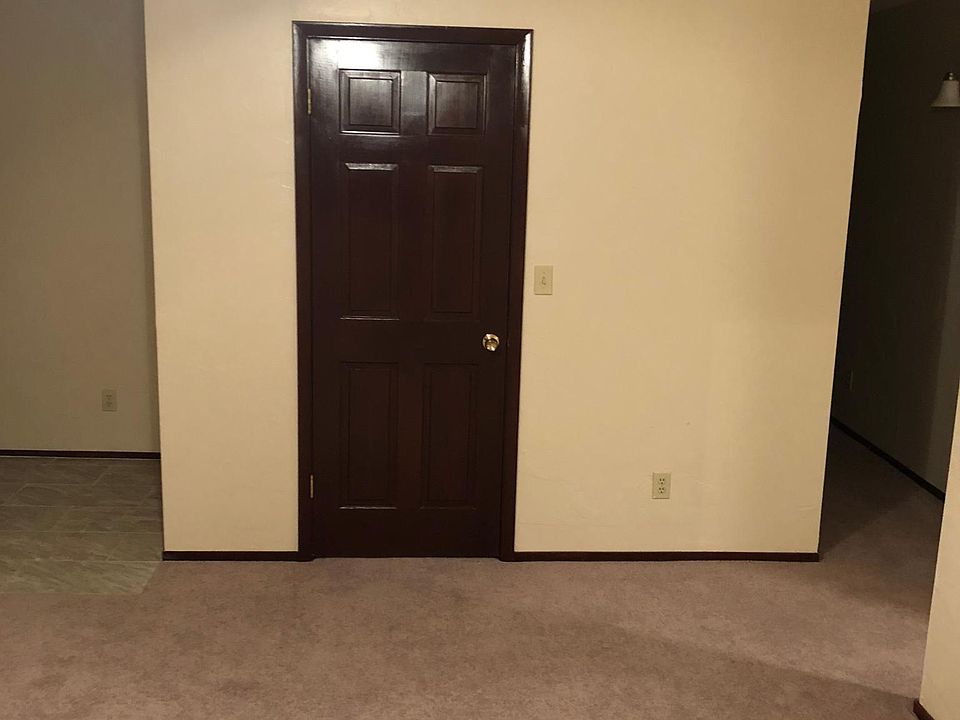 Coat closet and entry way to the left.