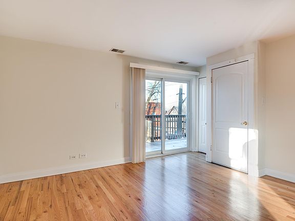 Living room looking toward street and your own private balco