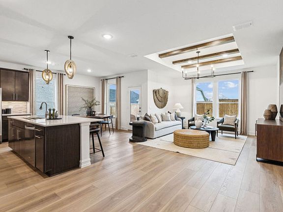 Open-concept throughout main living areas model representation