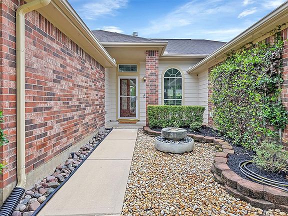 Water fountain and zen garden welcome you home. The front door has a storm door.