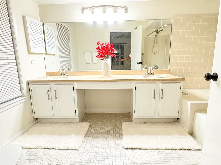 Large, bright master bathroom attached to master bedroom