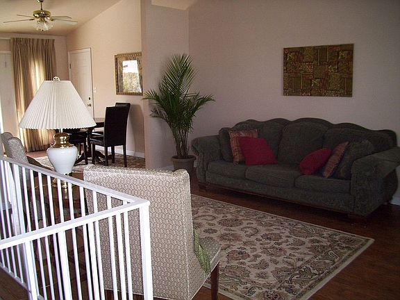 livingroom with open stairway and vaulted ceilings