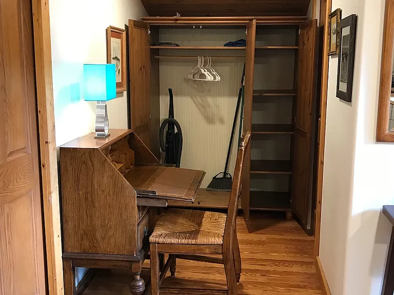 Close up of the storage cabinet and desk ready to be used.