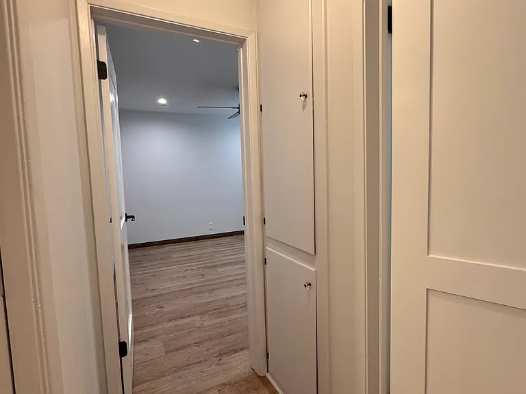 Hallway access to bedroom and bathroom
