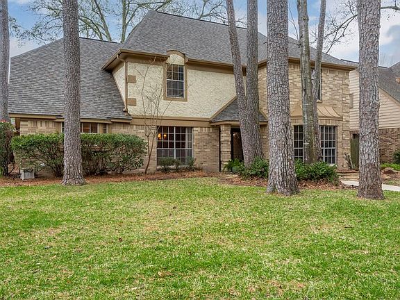 Mature trees and amazing landscaping highlight this corner lot.