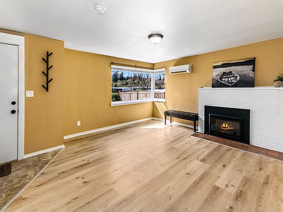 Bright living room with large corner window