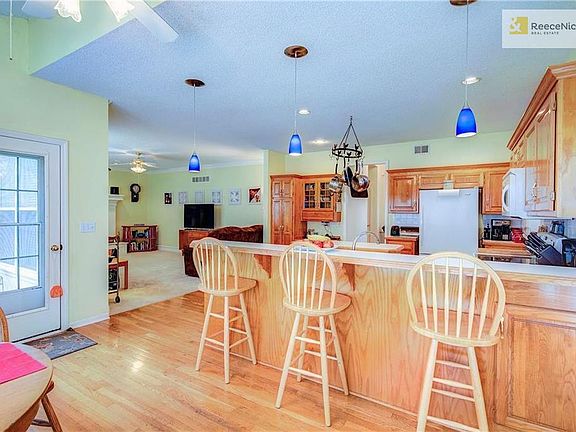 Kitchen opens up to large family room.