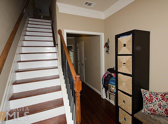 Bottom floor entrance.  Entry from Garage and full bedroom on main with full private bathroom and walk in closet.
