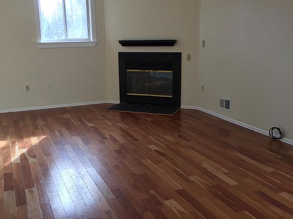 Living room with wood burning fireplace