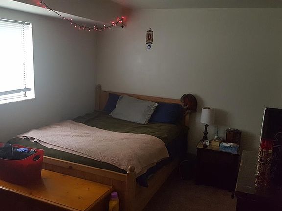 Bedroom with a closet and an attached utility room for extra