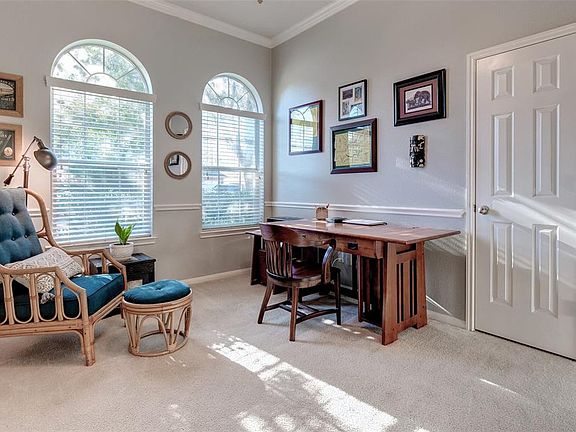 The spacious study has double arched windows allowing in plenty of natural light, making this the perfect space to work from home or relax and read your favorite novel on a lazy weekend.