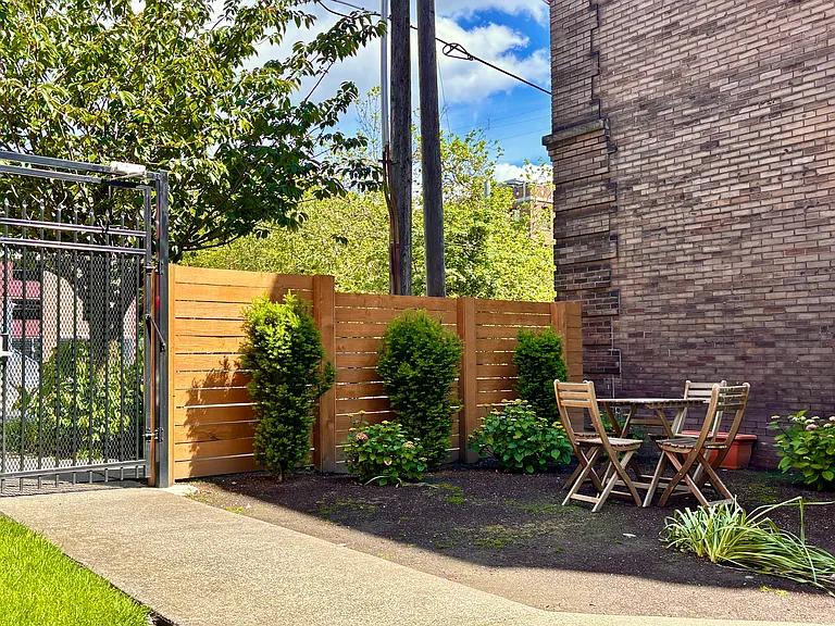 Property Front Yard with communal lounge area and communal planter