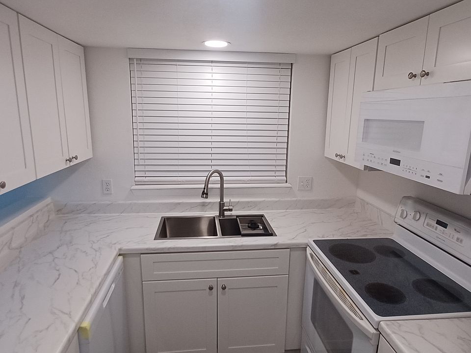 Kitchen: New cabinets, sink, faucet, window coverings, flooring, appliances.