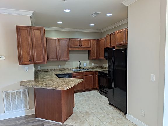 Kitchen with double door ref with ice and water on door, microwave OTR and DW.