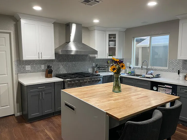 Newly remodeled kitchen with plenty of storage, island, 6 burner stove, + dishwasher.