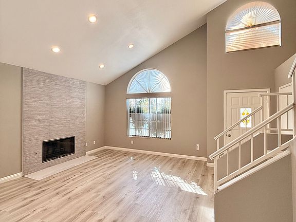 Dining room to entrance and fireplace.