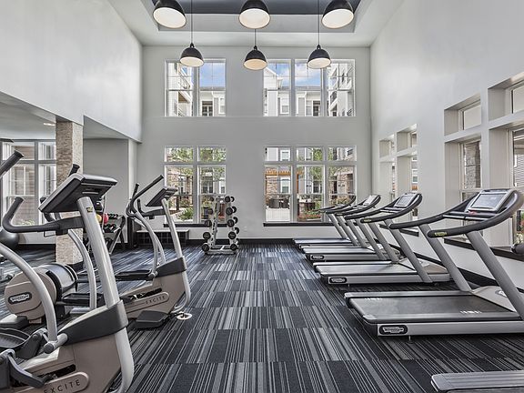 Fully-Equipped Fitness Center with Highly-Specialized Technogym Cardio Machines, Free Weights, Spin Bikes, and Individual Strength Training Machines