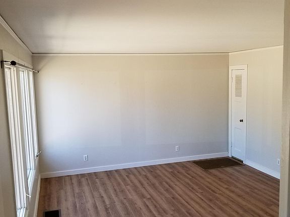 View of living room area taken from front door/stairwell.