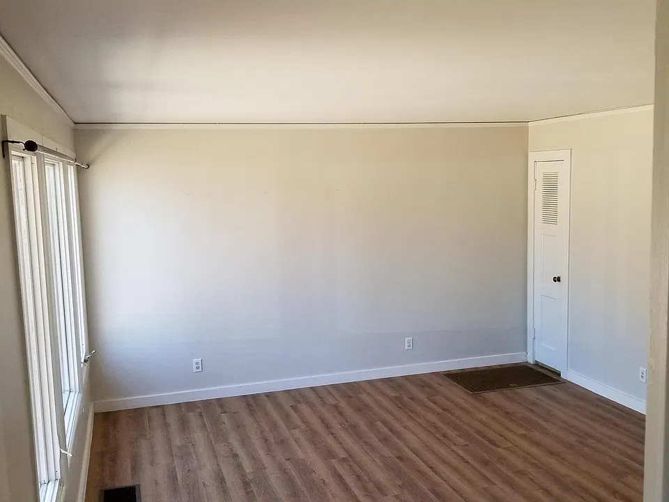 View of living room area taken from front door/stairwell.