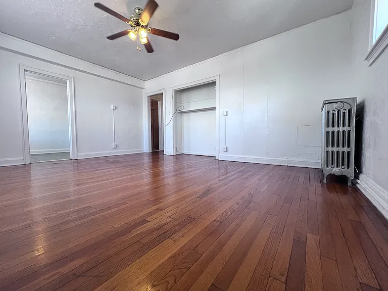 Warm hardwood floors and an open layout create a bright and inviting living space with plenty of room to relax, work, or entertain.