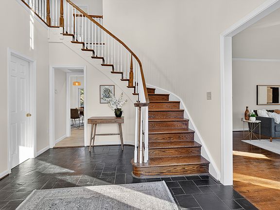 Front Foyer with Curved Staircase