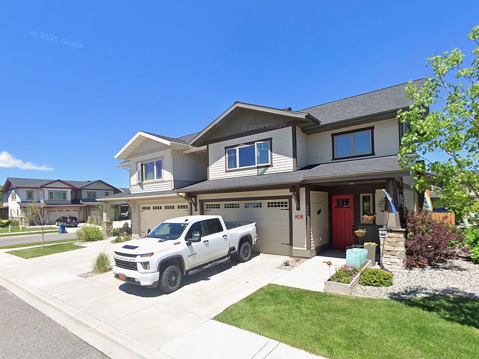 Front Yard mowed by HOA, flower bed with perennial flowers, Ring camera, two car garage
