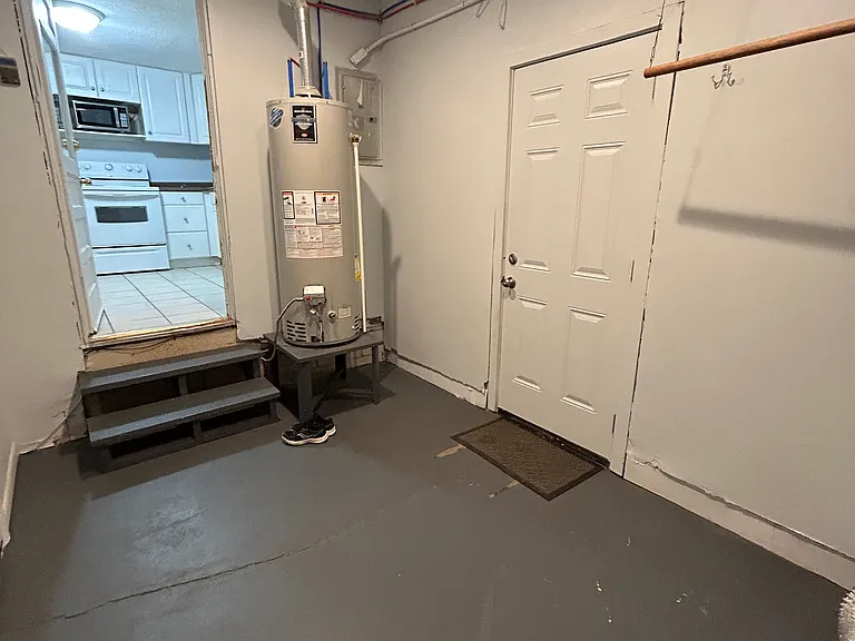 View from mud room into kitchen. Door to backyard is visible on the right.