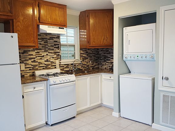 Recently renovated kitchen with stack w/d