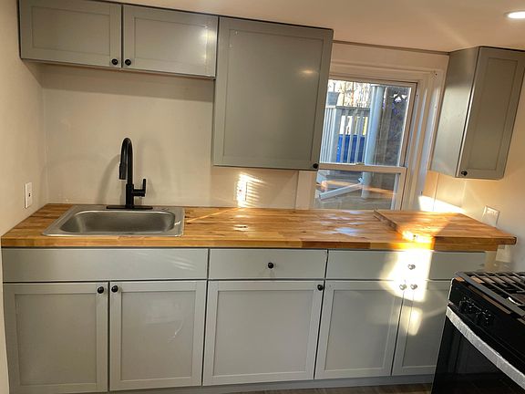 Butcher block counter top, brand new gray cabinets
