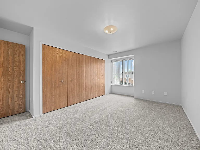 Bedroom with Ample storage space at Prentiss Pointe Apartments in Harrison Township, MI