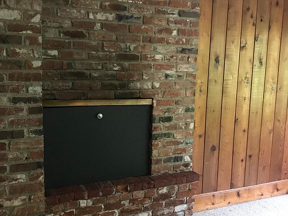 Wood burning fireplace in living room