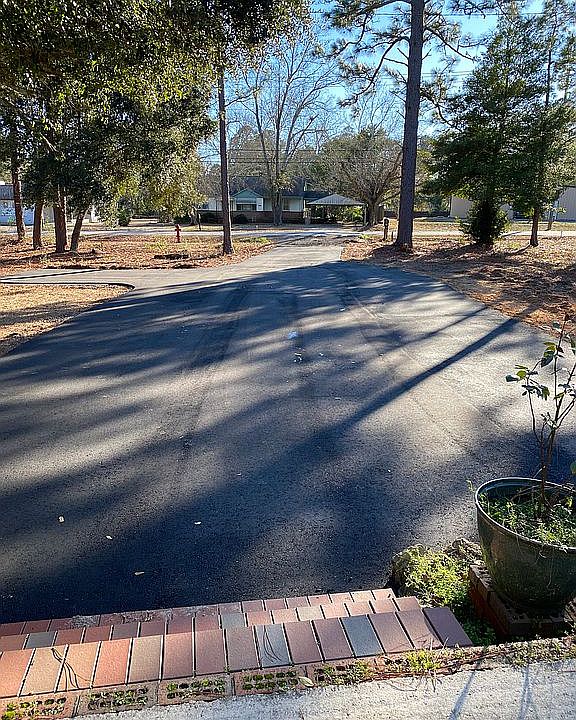 Asphalt drive way all the wa