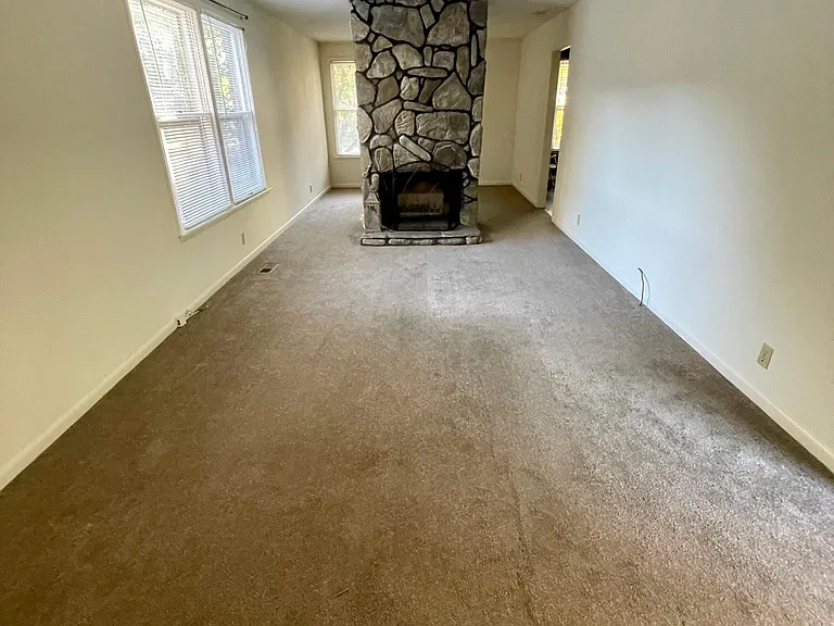 This is the large living room that is connected to the dining area The beautiful fireplace is real but we have made it inoperable for everyone's safety. I have purchased beautiful logs to be in the fireplace for a beautiful look. The screen will be lef