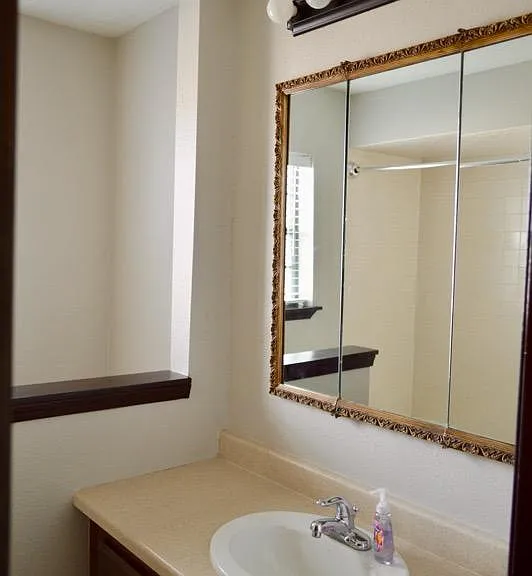 Full Guest Bath, 3 way medicine cabinet mirror for extra storage.