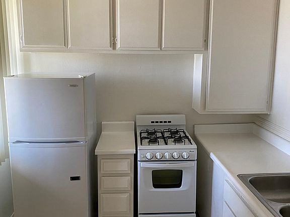 Kitchenette complete with gas stove and refrigerator