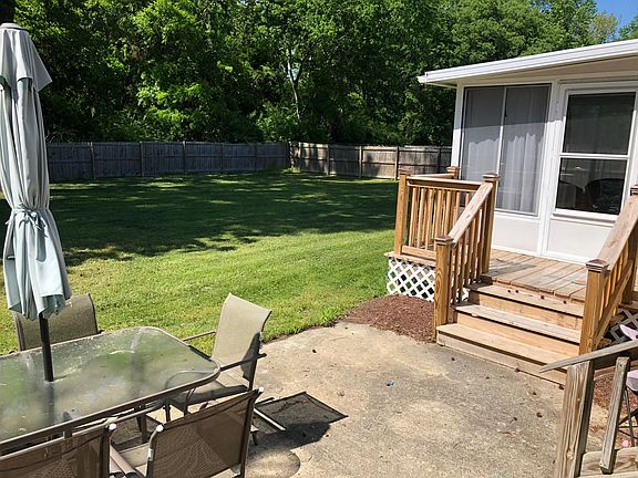 Backyard, patio, deck, and sunroom