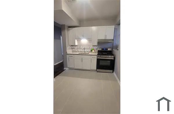 Building Photo - 1136 W 68th St #1