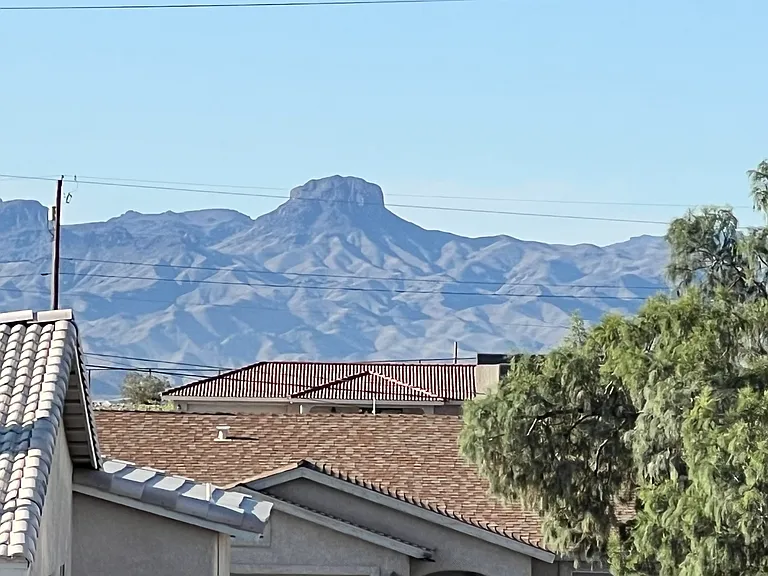 The landmark "Cupcake Mountain" is visible behind the home