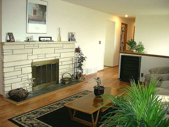 Gleaming Hardwood Floors & Brick Hearth Fireplace