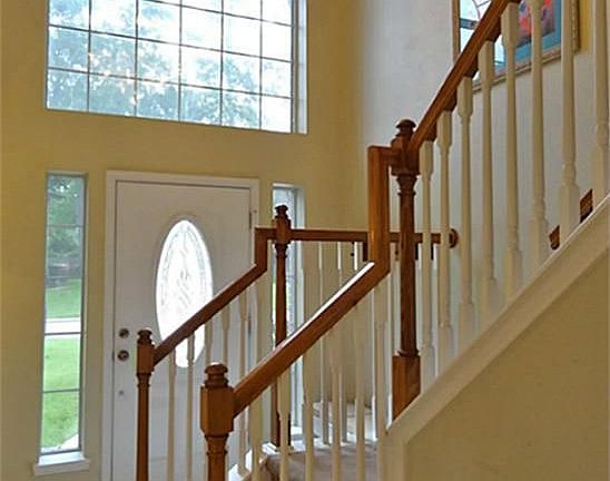 Foyer has a soaring 2-story entry with ceramic tile floors and staircase with wood banister & spindles.  Ceramic throughout the downstairs was replaced in 2013.