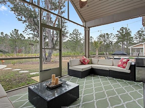 Covered Screened in Porch looking out to the lake