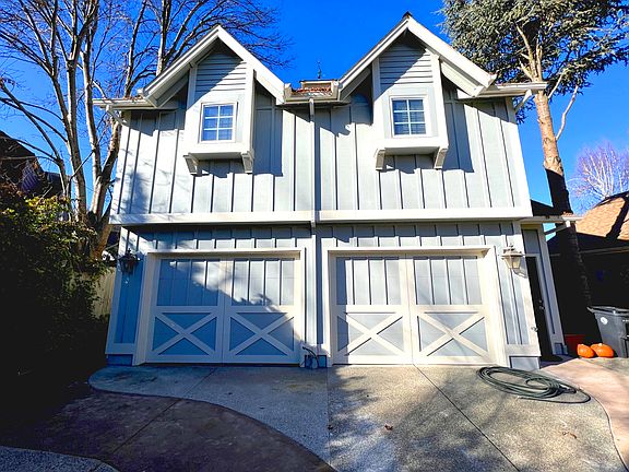 The garage has an opener, storage cabinets and a tenant in the apartment above the garage.