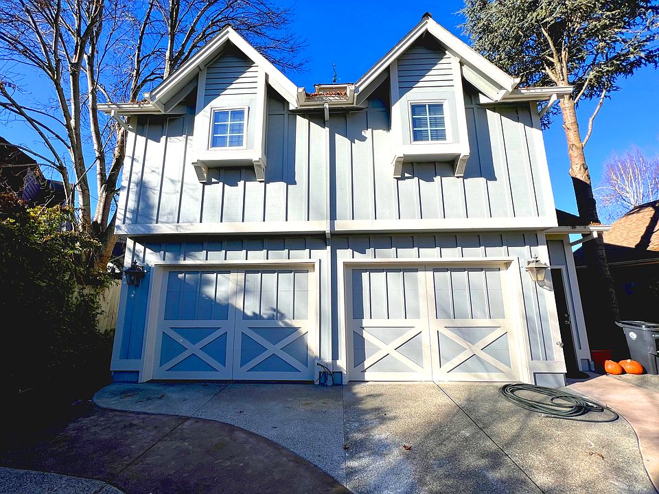 The garage has an opener, storage cabinets and a tenant in the apartment above the garage.
