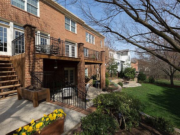 Rear Patio and Deck overlooking level backyard