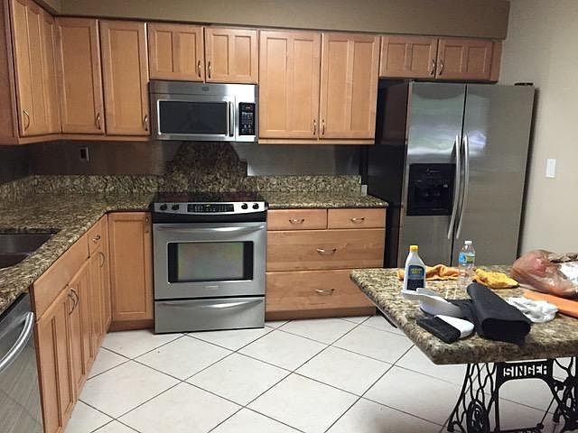 Huge open kitchen with a 6x5 ft granite table included (sits