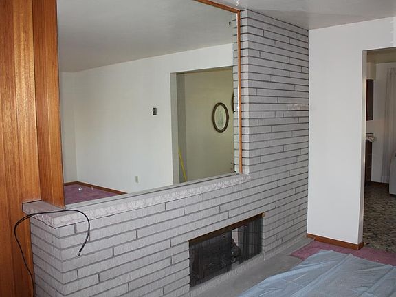 mirror above fireplace