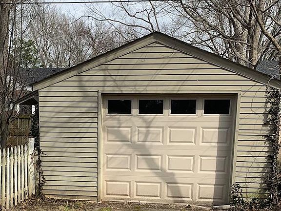 Detached 1 car garage with remote door.