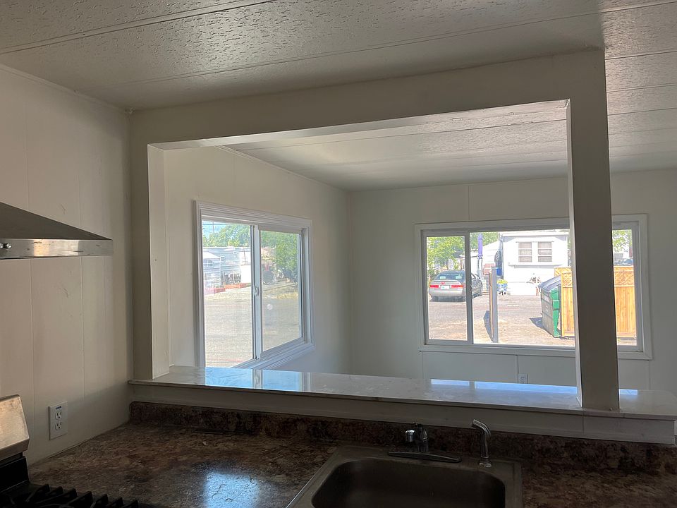 From kitchen to living, left. All new dining bar, stainless steel sink.